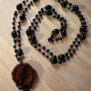 Fabulous aged cedar with Black Stealie on vintage bead Necklace